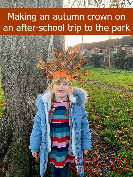 Sophie standing in front of a tree wearing her autumn crown - "Making an autumn crown on an after-school trip to the park"