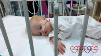 A sleeping Thomas in a hospital cot