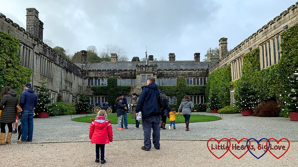 Hubby and Sophie standing in front of the house at Lanhydrock