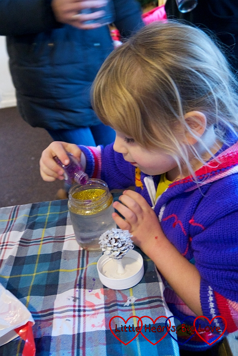 Sophie making a snow globe in activity hour