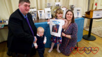 Hubby, Thomas, Sophie (holding her JoGLE for Jessica T-shirt) and me in front of the trophy table at the Land's End - John O'Groats Annual Dinner