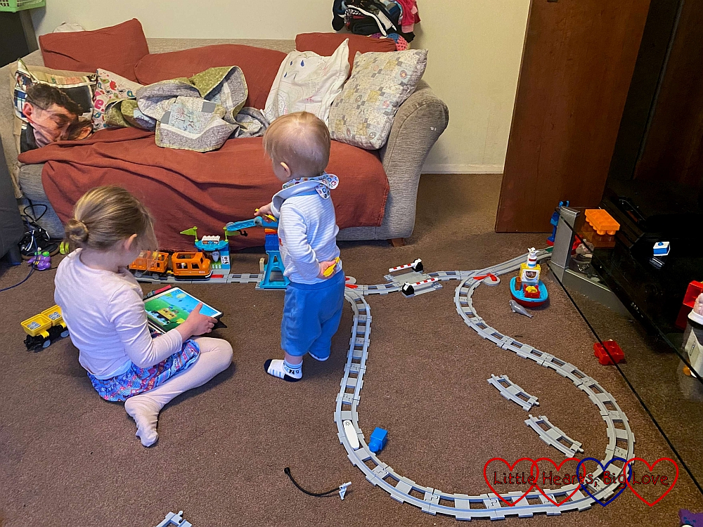 Sophie and Thomas playing with the Duplo train