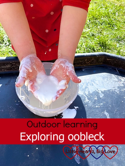 Sophie holding liquid oobleck in her hands - "Outdoor learning: exploring oobleck"