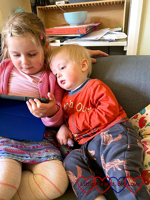 Thomas and Sophie, snuggled up and watching the iPad together