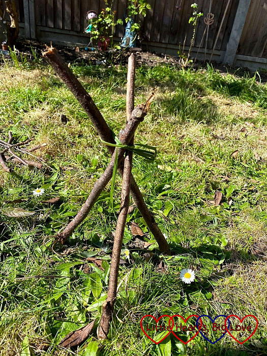 Three sticks tied together in a pyramid shape