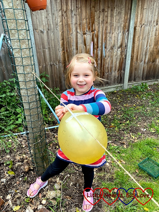 Sophie about to let a balloon rocket go