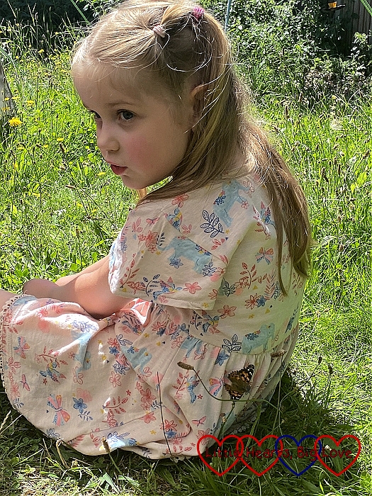 Sophie with a butterfly on the back of her dress