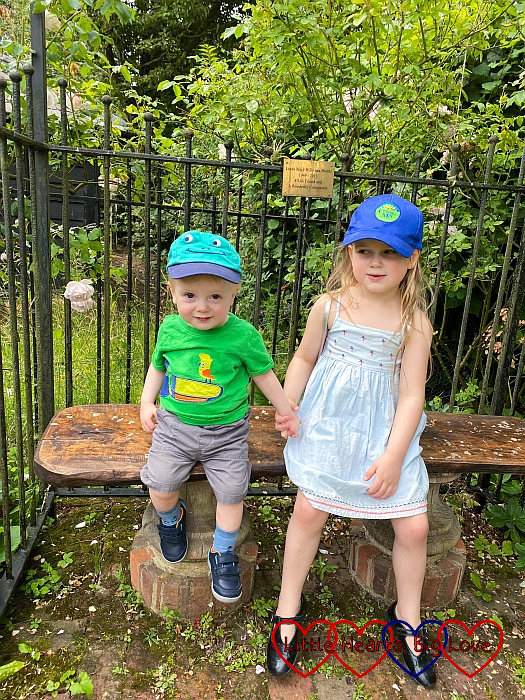 Sophie and Thomas sitting on a bench at Chiltern Open Air Museum