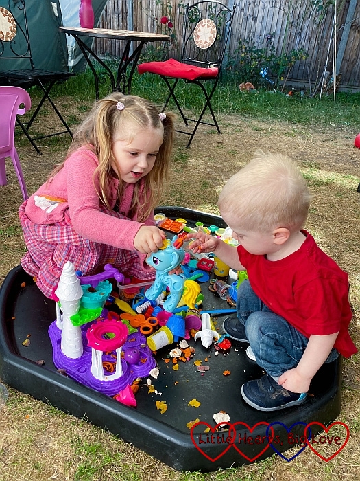 Sophie and Thomas playing with playdoh in the tuff tray