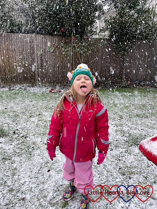 Sophie catching snowflakes on her tongue