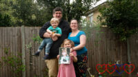 Hubby (holding Thomas), me and Sophie (holding a photo of Jessica) out in the garden