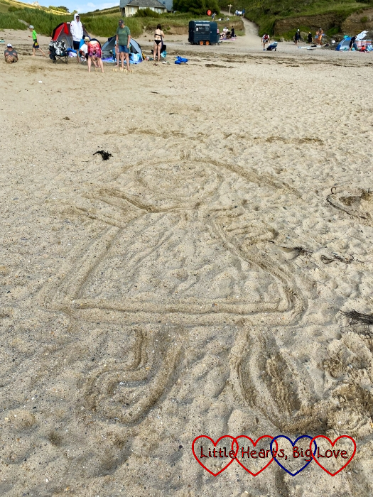 Sophie’s drawing of Jessica in the sand at Baby Bay beach