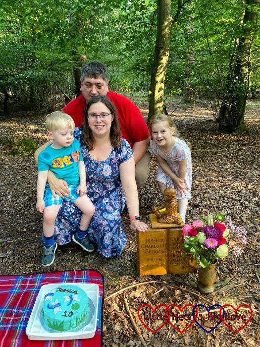 Thomas, me, hubby and Sophie at Jessica's forever bed on Jessica's 10th birthday with her birthday cake on a picnic rug in front of us