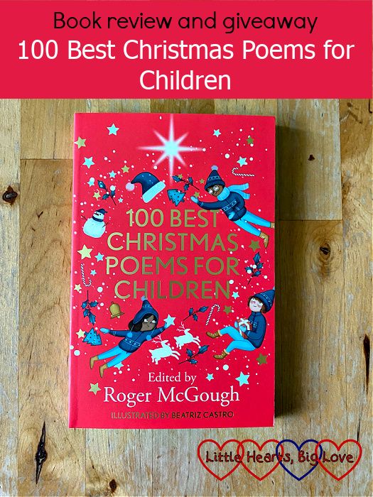 A copy of '100 Best Christmas Poems for Children' on a wooden table - "book review and giveaway: 100 Best Christmas Poems for Children"