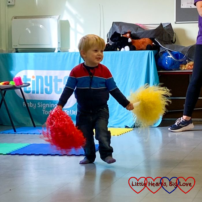 Thomas dancing with red and yellow pompoms at TinyTalk