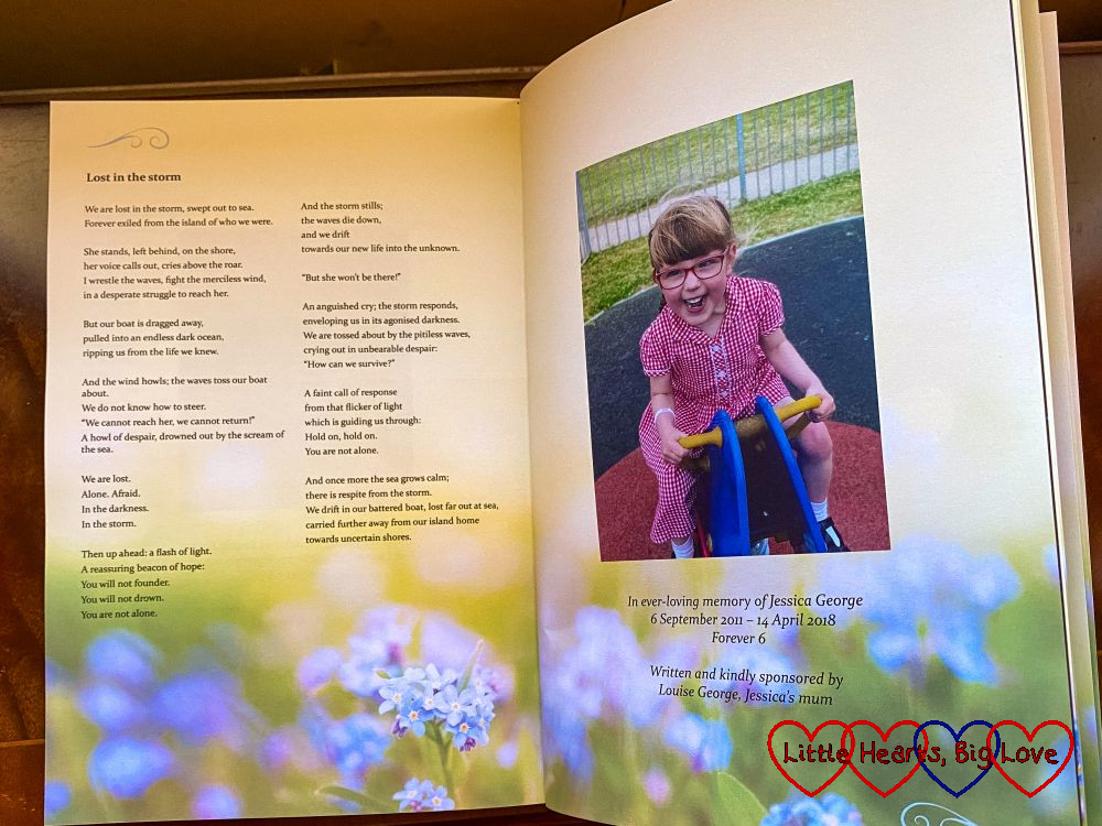 An open book of poems showing my poem with a photo of Jessica