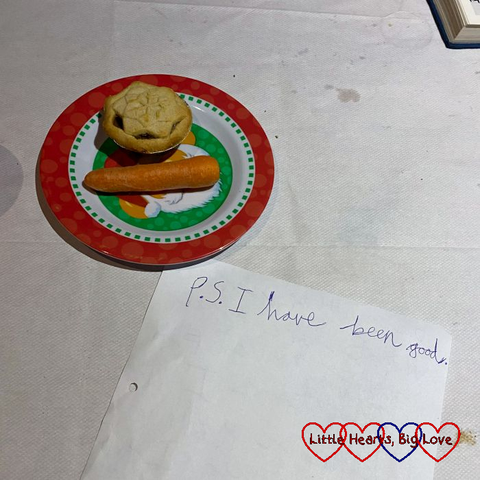A mince pie and carrot on a plate plus a note that says "P.S. I have been good."