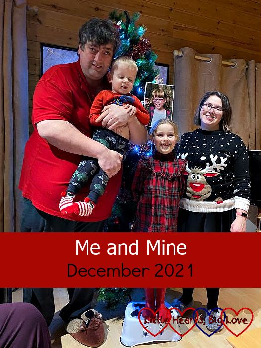 Hubby, Thomas, Sophie and me (holding a photo of Jessica) in front of a Christmas tree