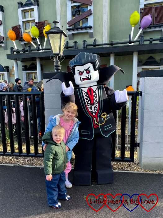 Sophie and Thomas standing in front of a giant Lego vampire figure