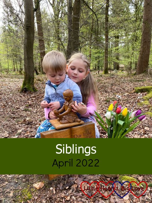 Sophie and Thomas looking at the wooden sculpture of Jessica at Jessica's forever bed - "Siblings - April 2022"