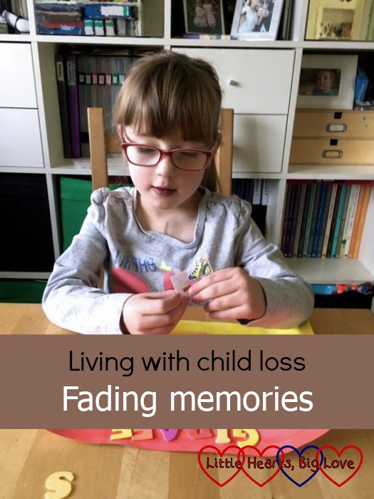 A faded picture of Jessica sitting at the table making a picture - "Living with child loss: Fading memories"