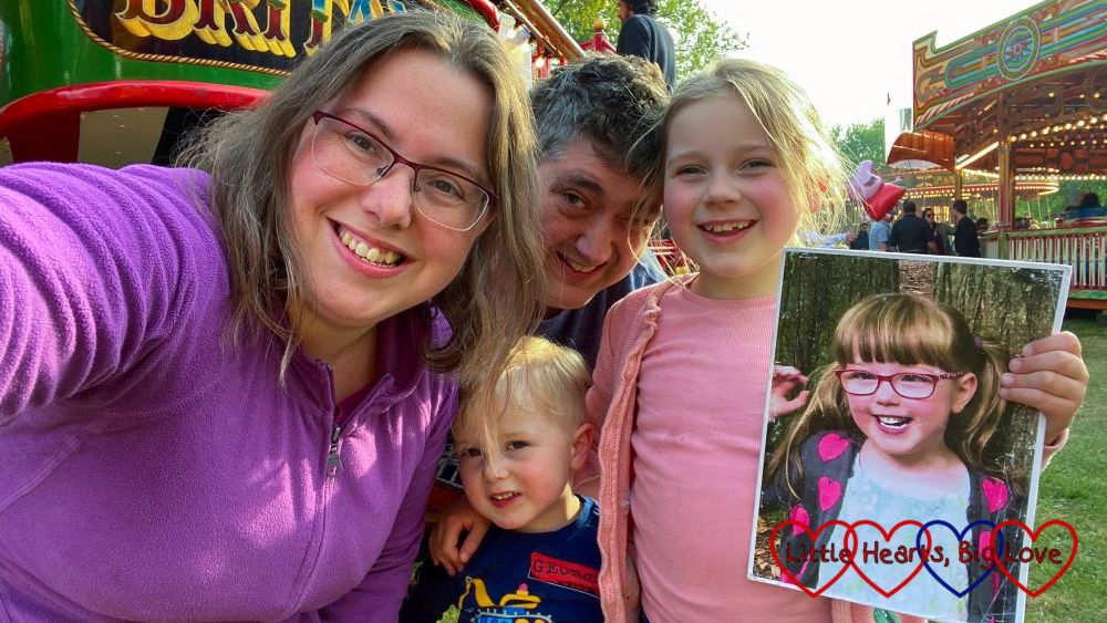 Me, Thomas, Daddy and Sophie holding a picture of Jessica at a fun fair