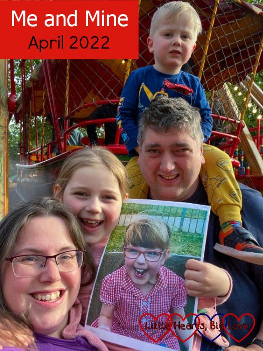 Me with Thomas on Daddy's shoulders and Sophie holding a picture of Jessica at a fun fair - "Me and Mine - April 2022"