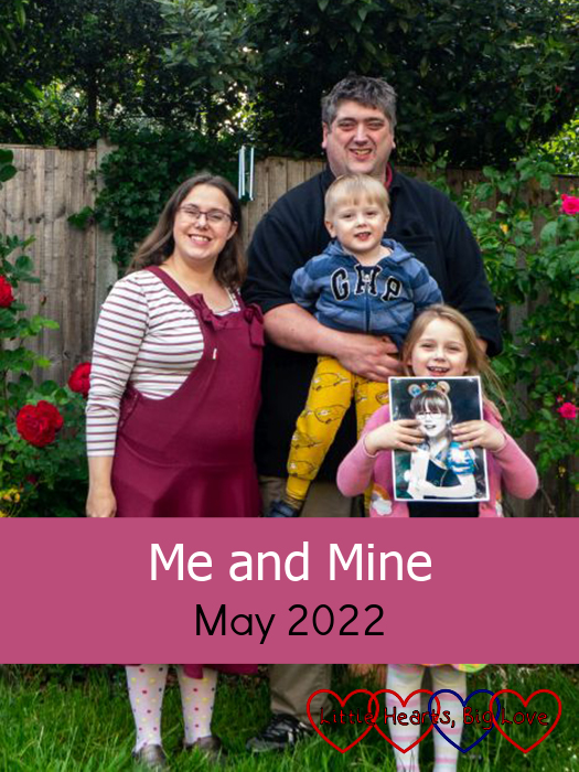 Me, my husband, Thomas and Sophie (holding a photo of Jessica) in the garden next to the roses - "Me and Mine - May 2022"