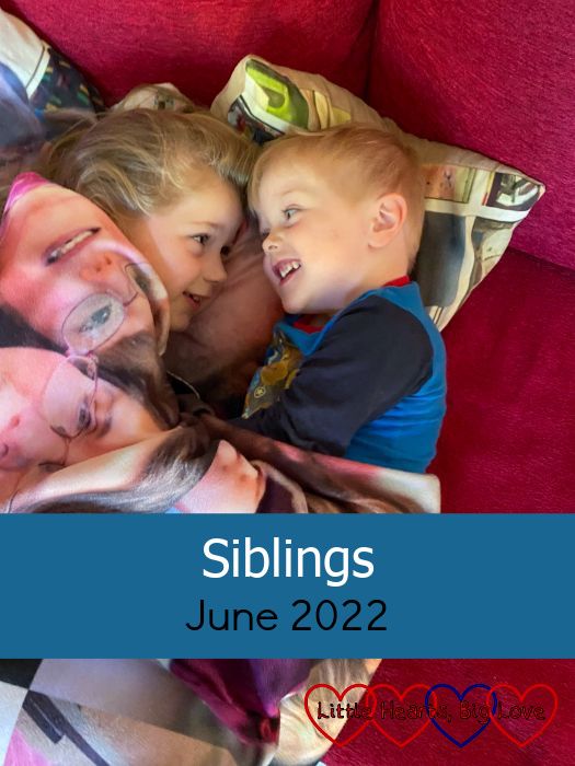 Sophie and Thomas snuggled up together under a blanket with photos of Jessica on - "Siblings - June 2022"