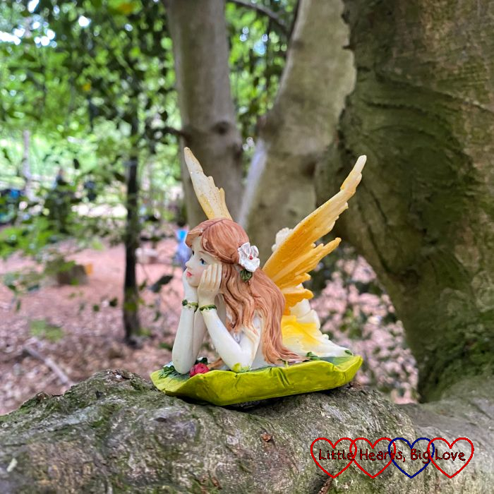 A model of a fairy on a tree branch