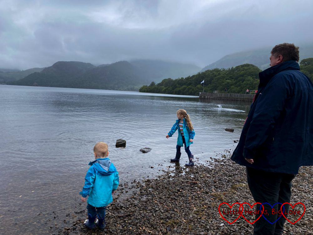 Sophie, Thomas and Daddy skimming stones at Ullswater