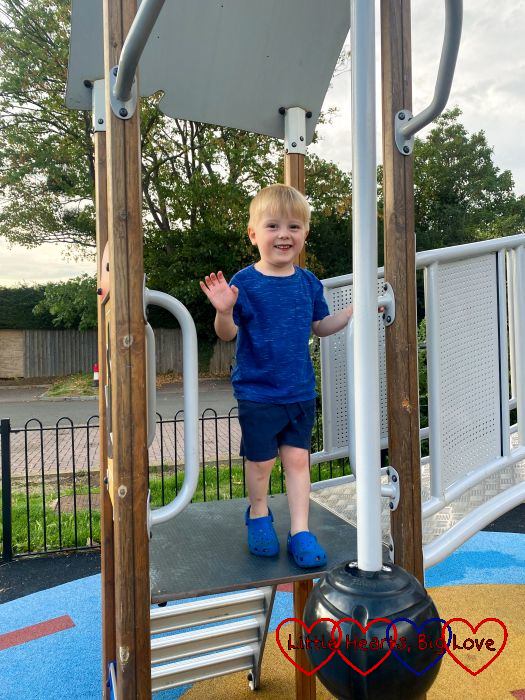 Thomas on the climbing frame at the park