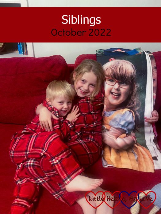 Sophie and Thomas cuddling on the sofa next to a photo of Jessica from her photo blanket - "Siblings - October 2022"