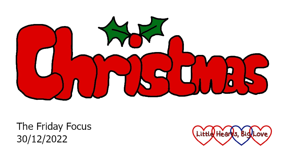 The word 'Christmas' in red with holly leaves either side of the dot of the 'i'