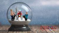 A Photoshopped picture of Jessica, Sophie and Thomas holding ice-skating penguins inside a snow globe
