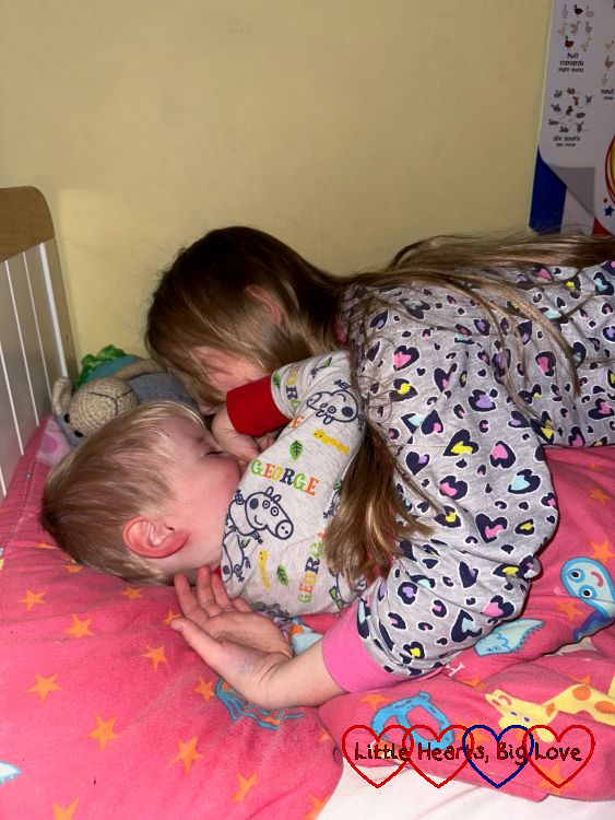 Sophie hugging Thomas at bedtime