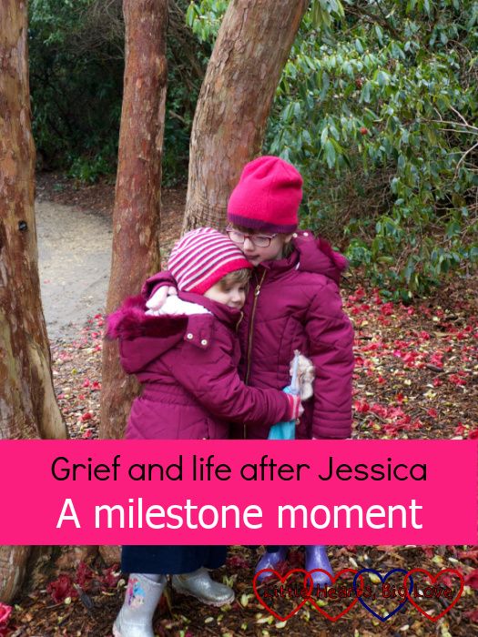 Sophie and Jessica wearing winter coats and hats, standing in front of a tree hugging each other - "Grief and life after Jessica: A milestone moment"