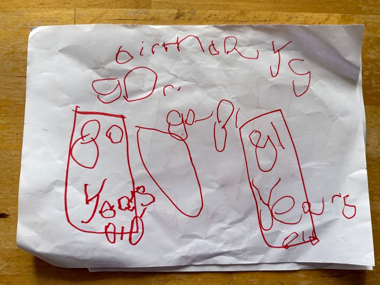 Thomas's birthday drawing for Grandma with the word 'birthday' and '80 years' and '81 years' written inside two boxes