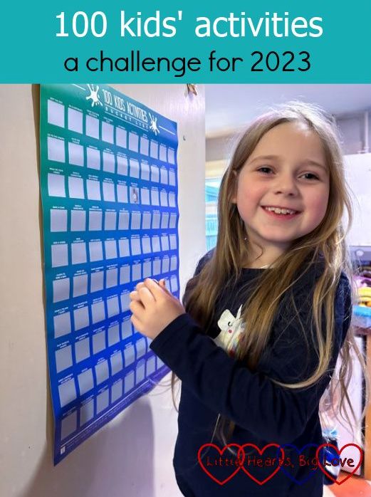 Sophie with the 100 kids' activities poster
