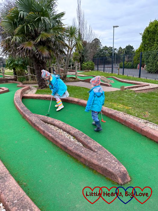 Sophie and Thomas playing crazy golf