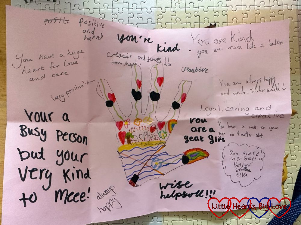 An outline of Sophie's hand surrounded by compliments written by her friends in Girls' Brigade