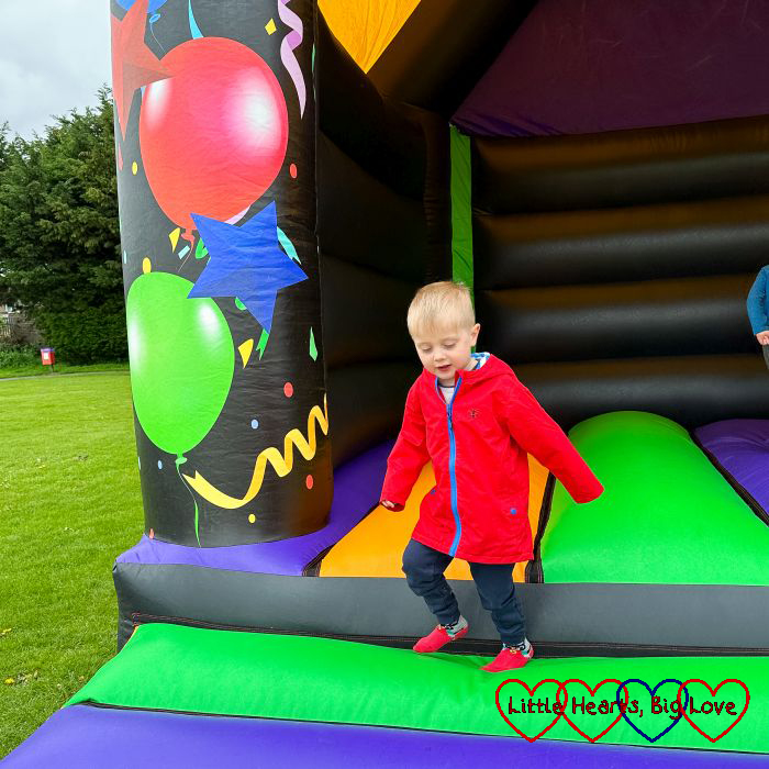 Thomas on the bouncy castle at the Coronation community event