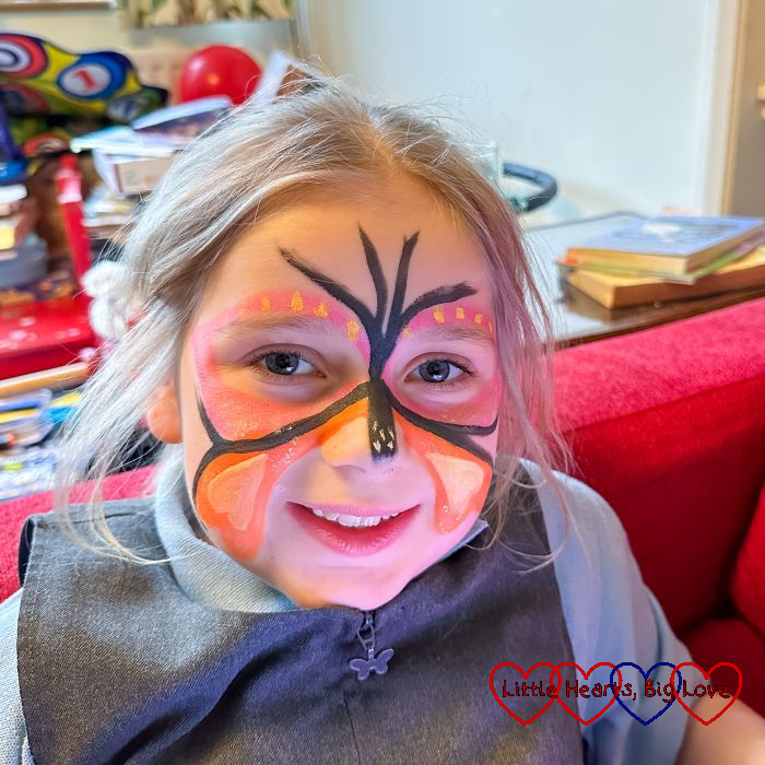 Sophie with her face painted as a butterfly