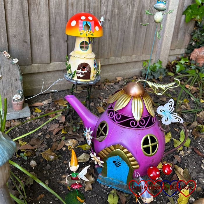 A teapot house and toadstool house in the fairy garden