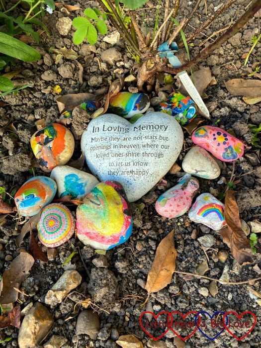 A heart shape stone with the words 'In loving memory. Maybe they are not stars but openings in heaven where our loved ones shine through to let us know they are happy."