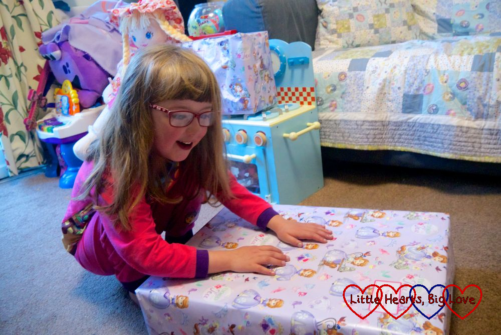 Jessica opening a present on her sixth birthday