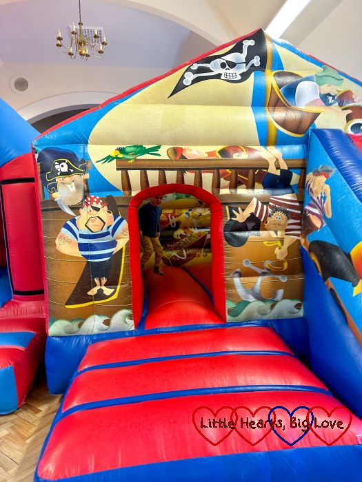 Thomas jumping on a pirate ship themed bouncy castle
