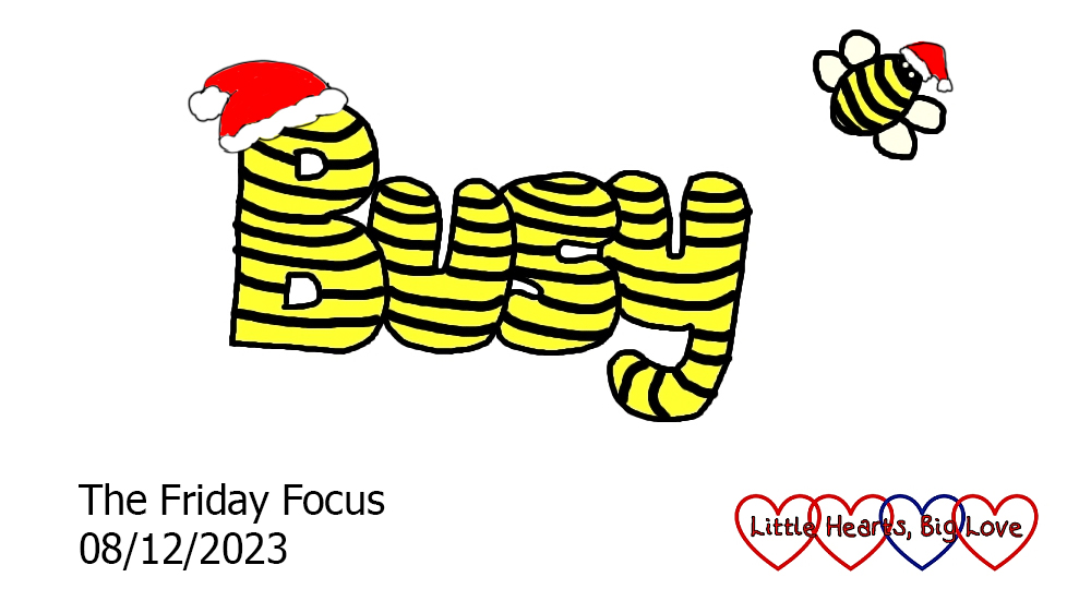 The word 'busy' in yellow with black stripes with a Santa hat on the 'B'. There is also a bee with a Santa hat flying to one side of the word