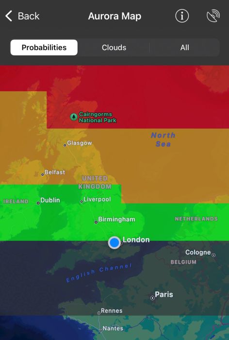 A phone screenshot of an aurora ovation map showing a red band across northern Scotland, an orange band across southern Scotland and northern England, a bright green band across northern England and the Midlands and a dark green band across southern England 
