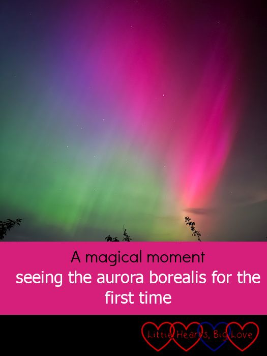 Bright pink, purple and green aurora borealis in the night sky - "A magical moment - seeing the aurora borealis for the first time"